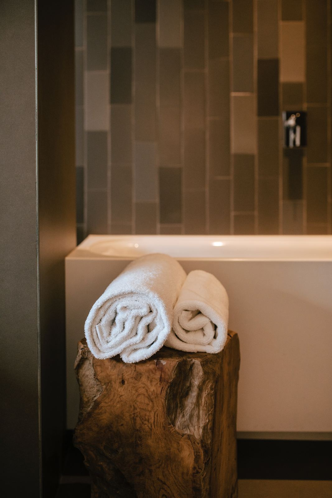 Hotel bath mat placed in a bathroom setting