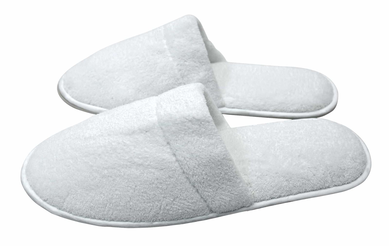 White hotel slippers on a plain background