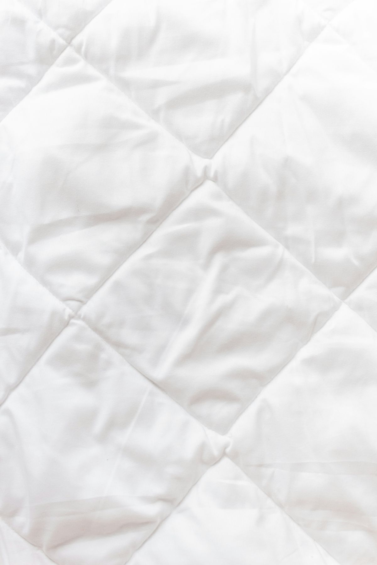 Quilted white protector fabric close-up